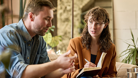 Psychologist talking to patient at meeting