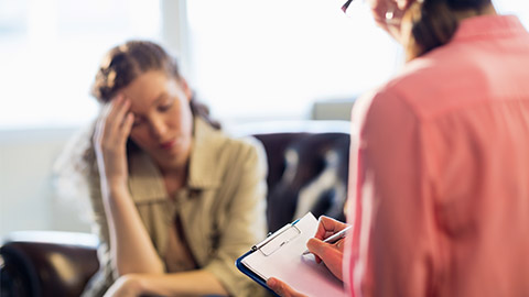 Psychologist having session with her patient in office