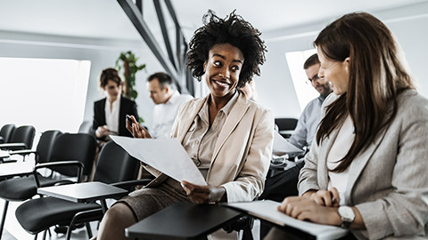 Women discussing on a document