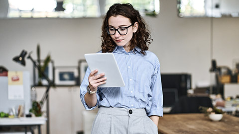 Young woman holding a tablet