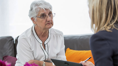 senior woman meeting real-estate agent for investment