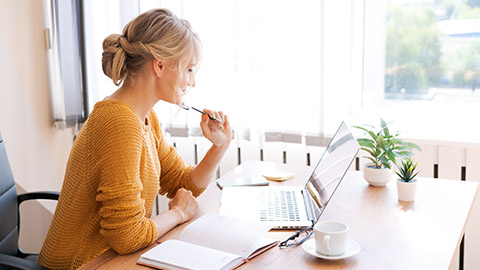 Thoughtful caucasian business woman looking away thinking about solving problem