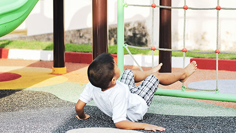 A child falling off play equipment