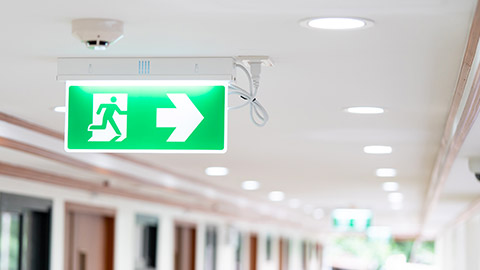 An emergency exit sign in a childcare centre