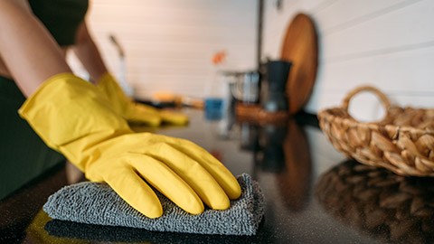 A close view of a worker cleaning a surface