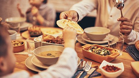 A close view of a family partaking in a meal