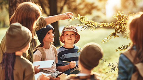 A teacher talking to students about the environment