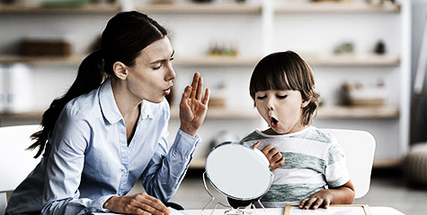 A person teaching a child animatedly