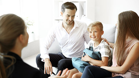 Family with son meeting with a school counselor