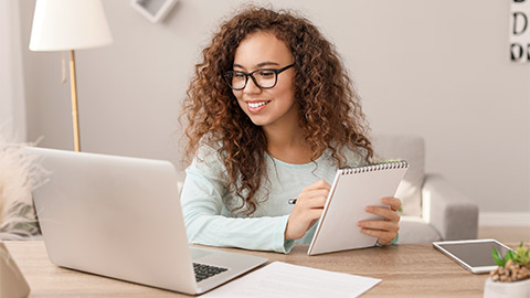 Young African-American businesswoman working at home