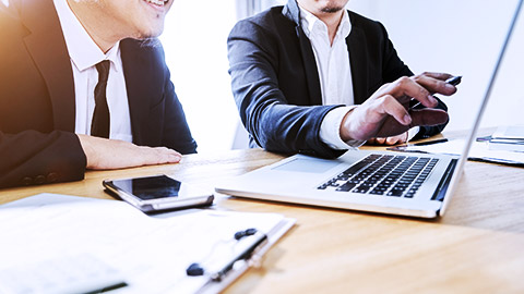 two business people discussing with computer