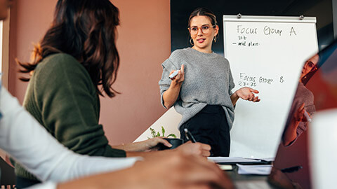 A person leading a discussion in a meeting