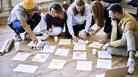 creative workers organizing project on floor