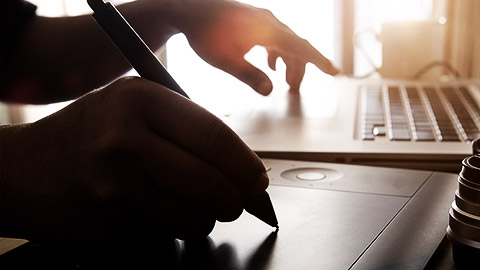 A graphic designer doing work with a tablet