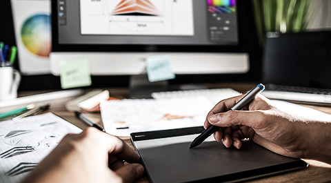 A person making a visual material with a tablet