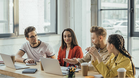 Successful business people working together in modern light office