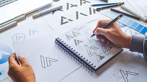 A designer working on a logo