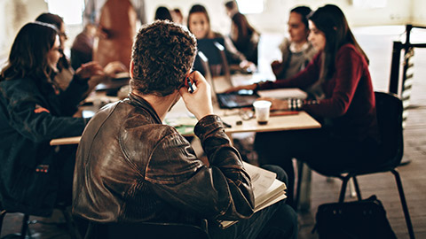 Designers discussing work in an office