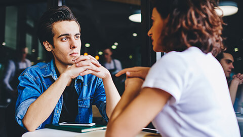 A manager listening to a coworker