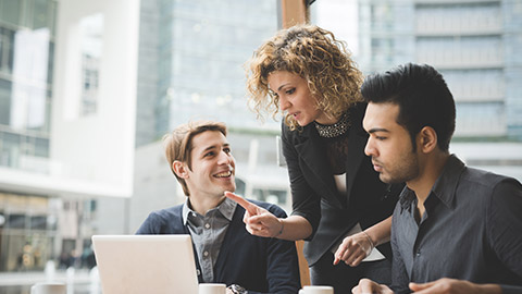 Multiracial contemporary business people working connected with technological devices