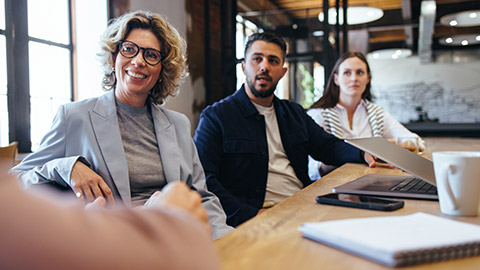 A group of colleagues having a meeting in a modern office