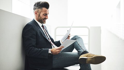 A manager reading a company policy document