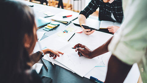 A close view of a team planning a project