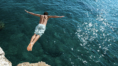 A person cliff diving