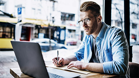 A person researching in a cafe