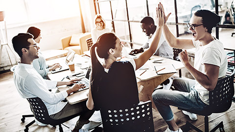 Group of employees celebrating a project completion