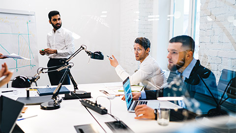 A management team conducting a strategy meeting in the boardroom