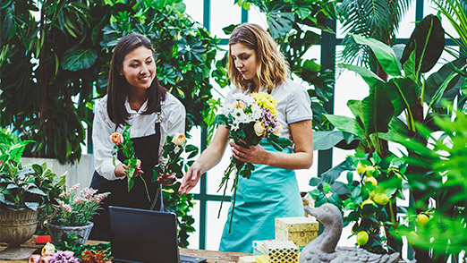 flosrists preparing arrangements for customers