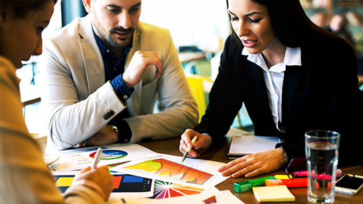 a group of professionals quizzing each other about budgets