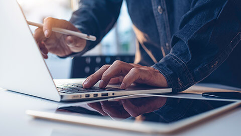 A close view of an accountant preparing to print a document from a laptop