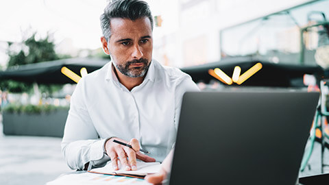 An accountant working on a spreadsheet on a laptop computer