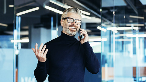 An accountant talking to a client through a phone