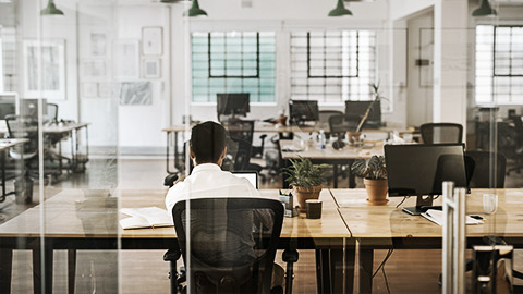 A person working alone in an office