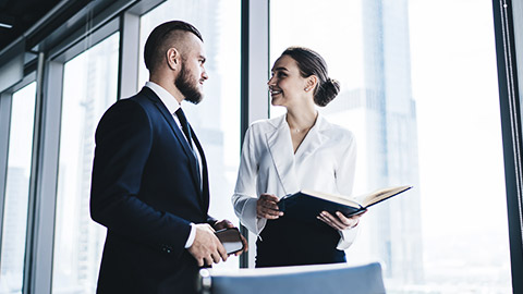 An accountant and a bookkeeper talking to each other