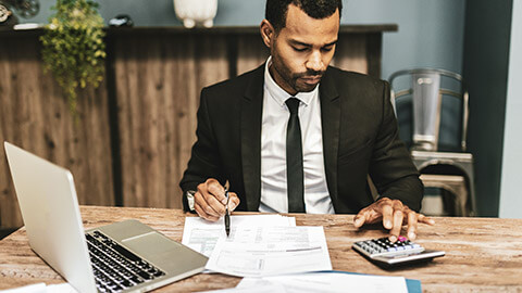 An accountant working on paperwork