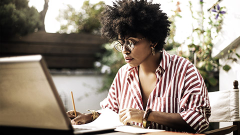 A small business owner doing paperwork in an office