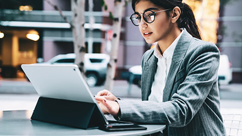 A business professional using MYOB on a tablet device