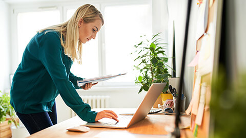 A small business owner using a laptop for finances