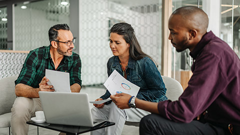 An accountant talking to some clients