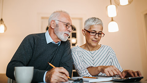 A couple of mature people checking their superannuation