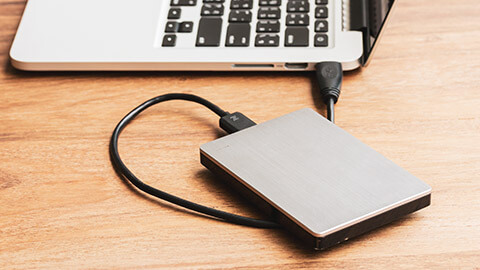 A close view of an external drive on a table