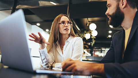 2 employees discussing an enterprise agreement in a workplace