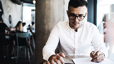 A person focused on phone to schedule a meeting with an employee