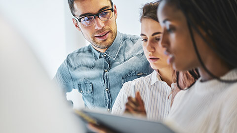 A group of colleagues having a serious discussion about a work-related topic