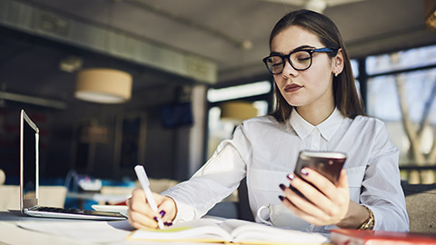 Young businessperson reviewing a complex document