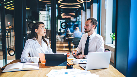 Two colleagues disrupting a meeting at work by engaging in an argument